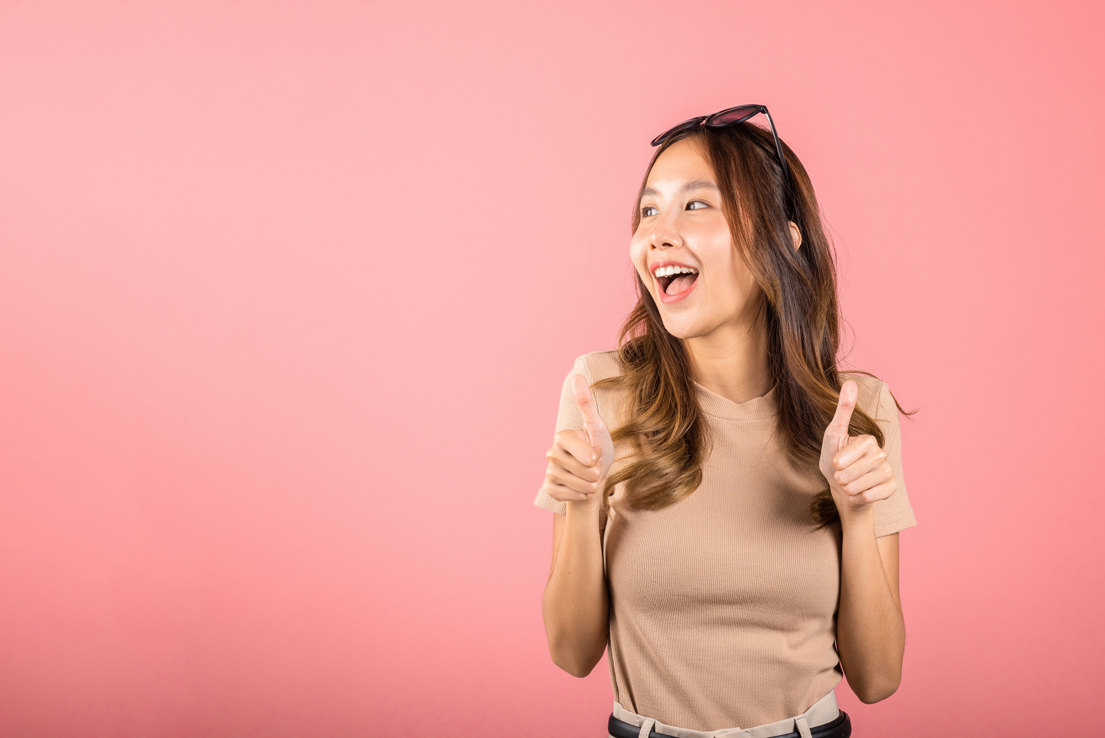 woman smiling she standing made finger thumbs up